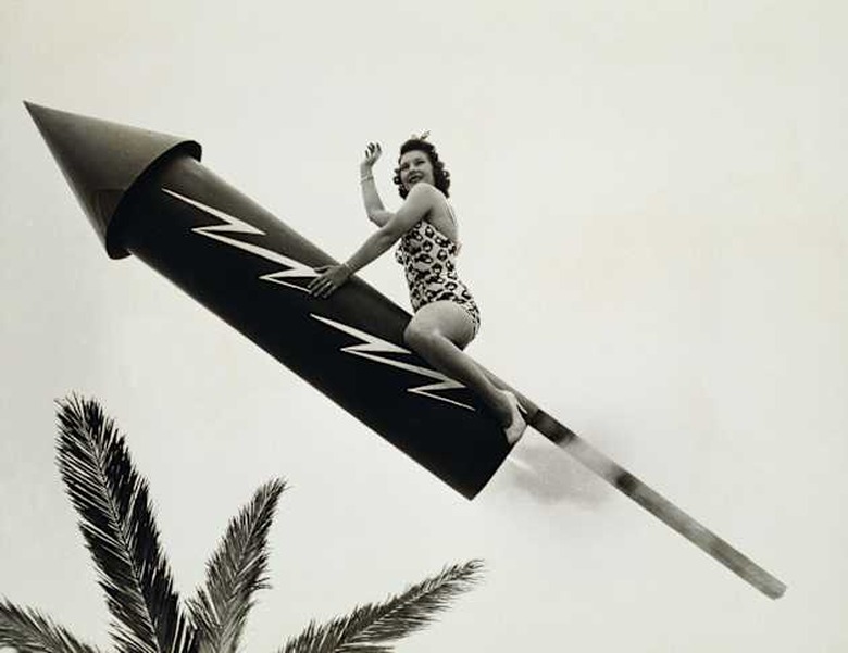 REAL FIRECRACKER, WOMAN FLIES THROUGH AIR ASTRIDE A GIANT FIRECRACKER,