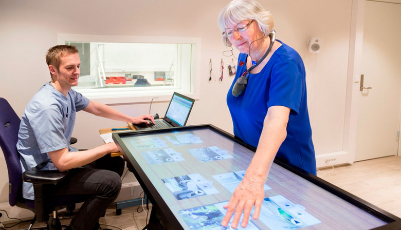 Tuning a hearing aid through a touchscreen
