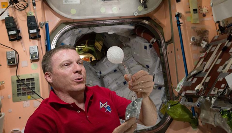 NASA's Terry Virts plays with a water bubble on the ISS in a 4K video
