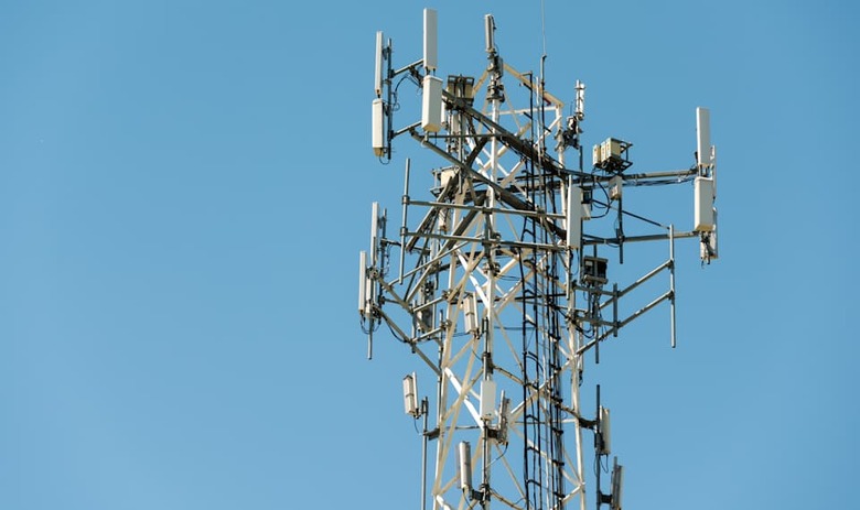 Top part of cell phone communication tower with multiple