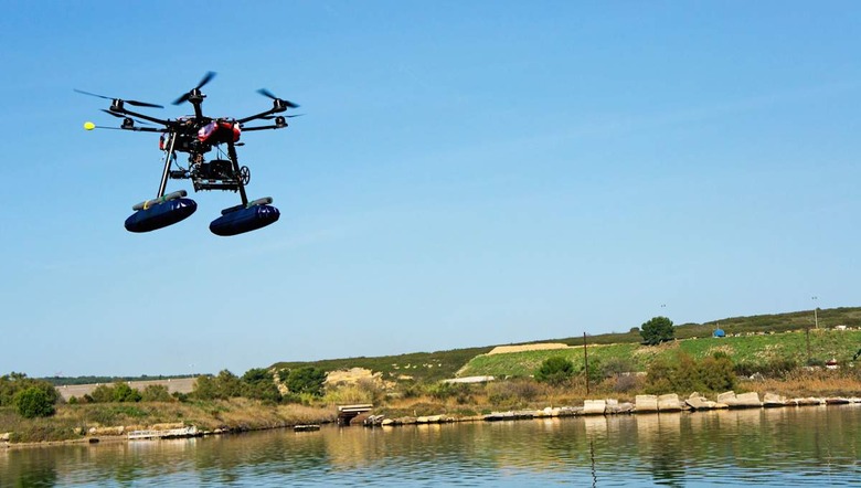 Drone or Unmanned Aerial Vehicle (UAV) used for photography / filming flying by canal de Caronte, Martigues, France