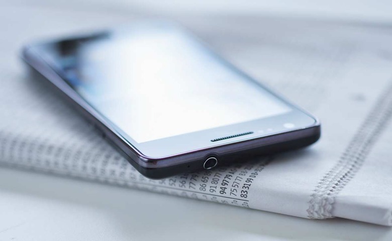Smartphone on newspaper