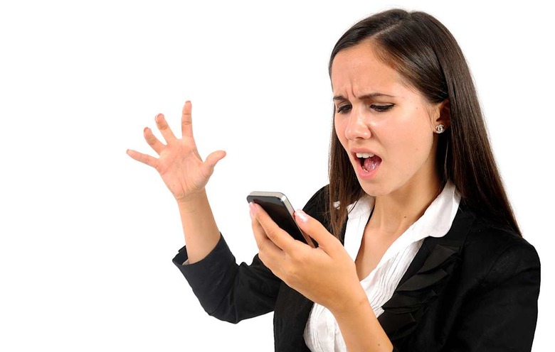 Isolated young business woman screaming at phone