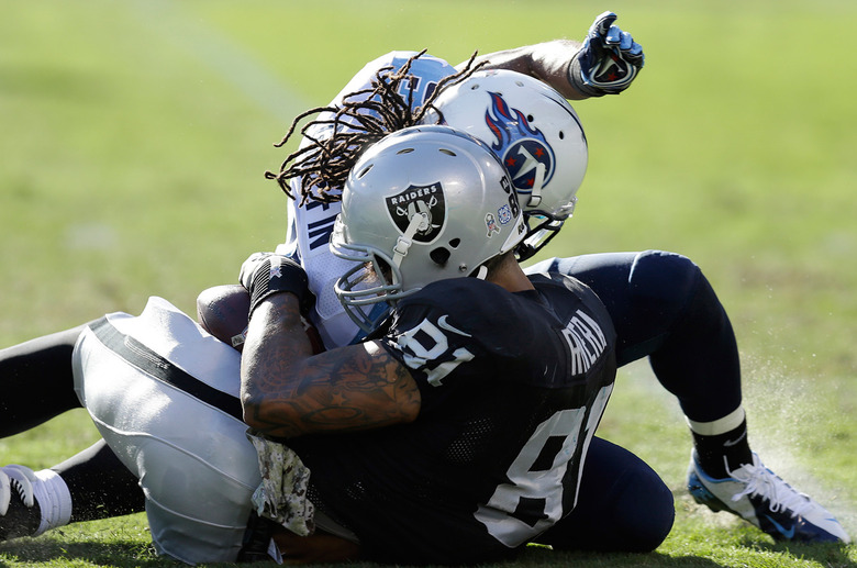 Titans and Raiders players collide, resulting in a head injury