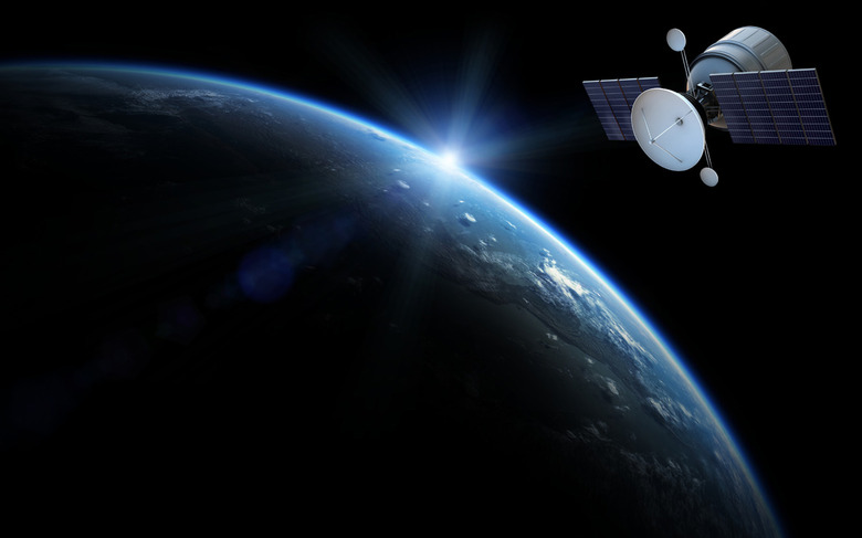A generic communications satellite in orbit above Earth