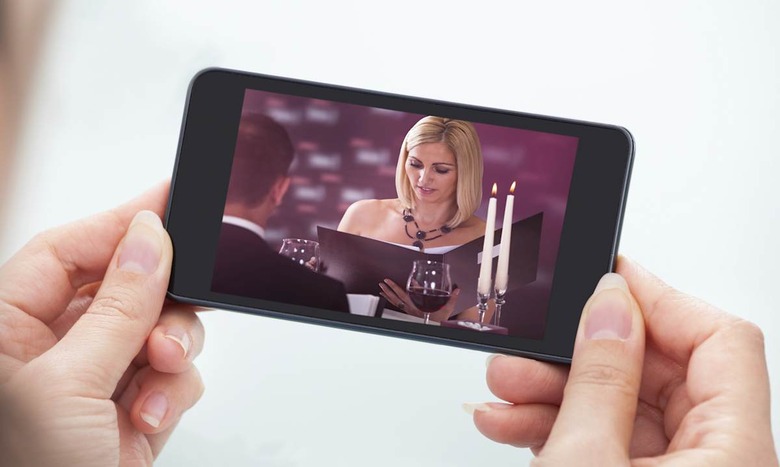 Person Watching Video On Cellphone