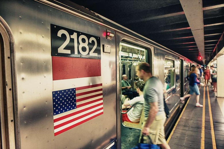 NEW YORK CITY - JUN 11: People wait for subway train, June 11, 2013 in New York City. The New York City Subway is also one of th