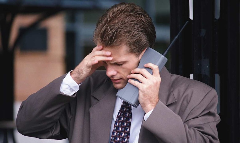 |adult|black|blue|brown|business|business and transportation|businessman|call|caucasian|cellular|center|color|day|distress|execu