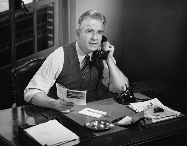 53036.JPG Businessman at Desk Index Stock