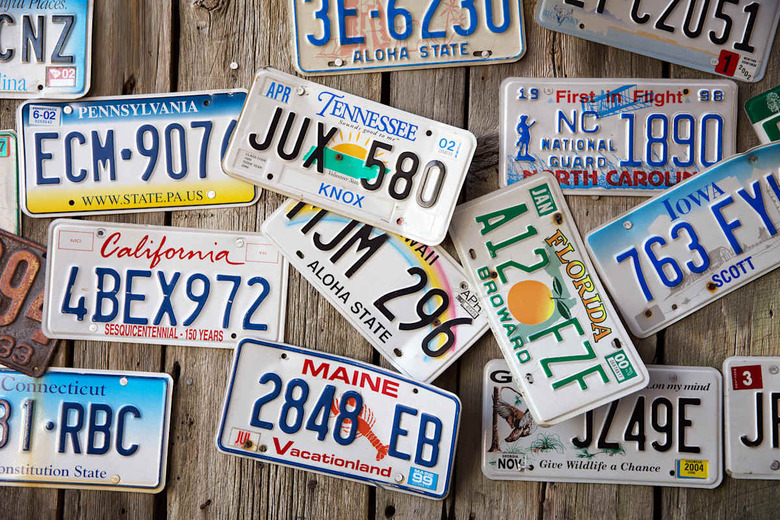 BAR HARBOR, MAINE - AUGUST 28: Old car license plates on a wall in Bar Harbor. In the United States, each jurirsdiction has a un