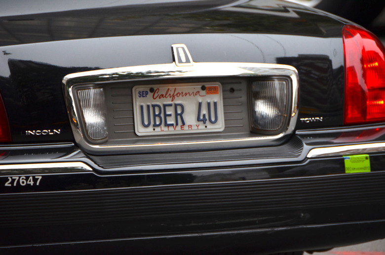 A Lincoln with a custom Uber license plate