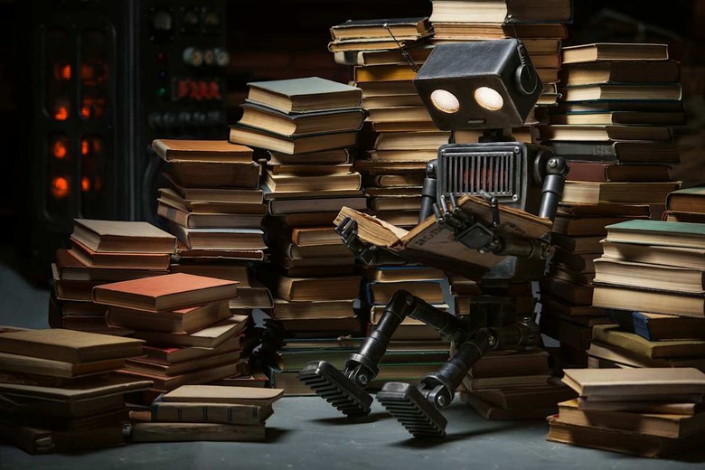 robot child reading a book in...