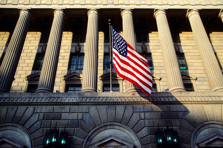 United States of America flag flies outside Department of Commerce building in Wall Street, New York City.