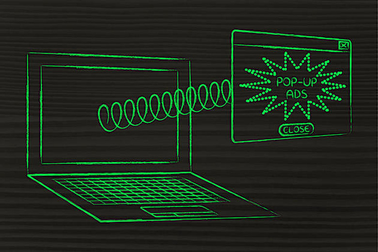 pop-up ads coming out of laptop screen with a spring