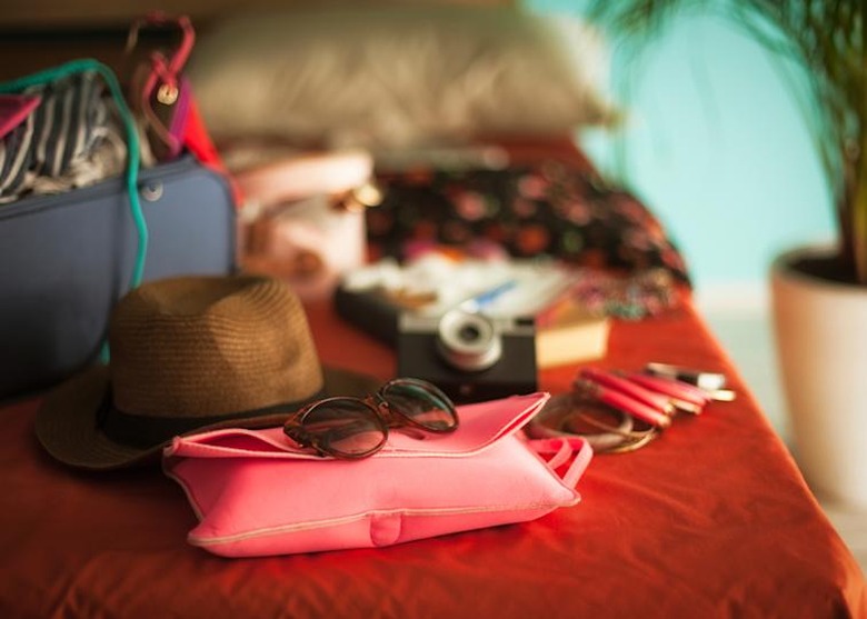 Holiday items on bed ready to pack 