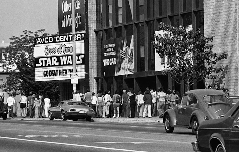** FILE ** In this June 7, 1977 file photo, theater goers wait in lines in front of the Avco Center Theater in Los Angeles to see