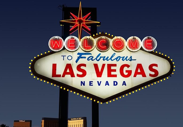 Lighted Las Vegas, Nevada welcome sign with night sky.