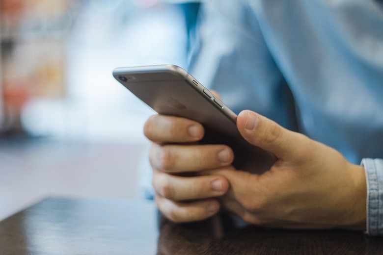 man-holding-an-iphone