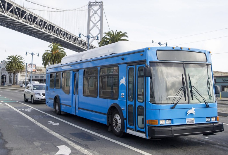 A Leap Transit bus drives passes under the Bay Bridge in San Francisco, California on March 23, 2015. Leap Transit's fleet of natural gas-powered luxury buses started their first route through the city this week, offering riders a new high-tech alternative to tightly packed city buses. AFP PHOTO/JOSH EDELSON (Photo credit should read Josh Edelson/AFP/Getty Images)