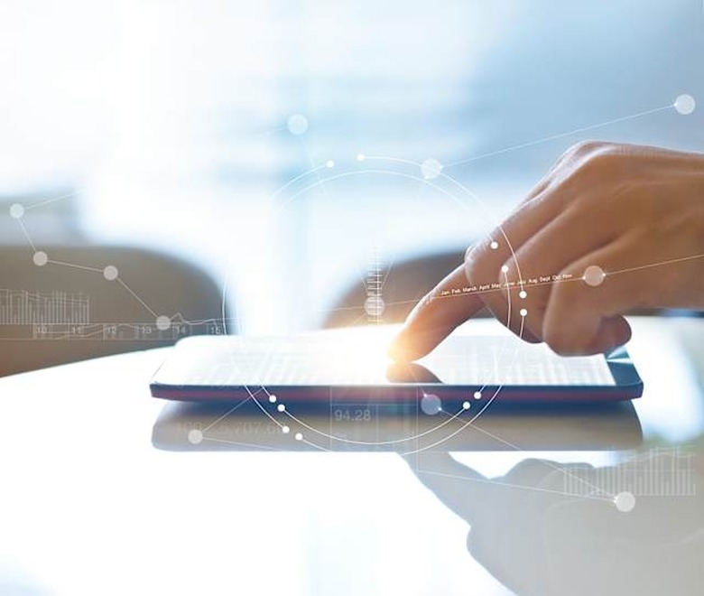 Hand of stock investment using smartphone for checking worldwide