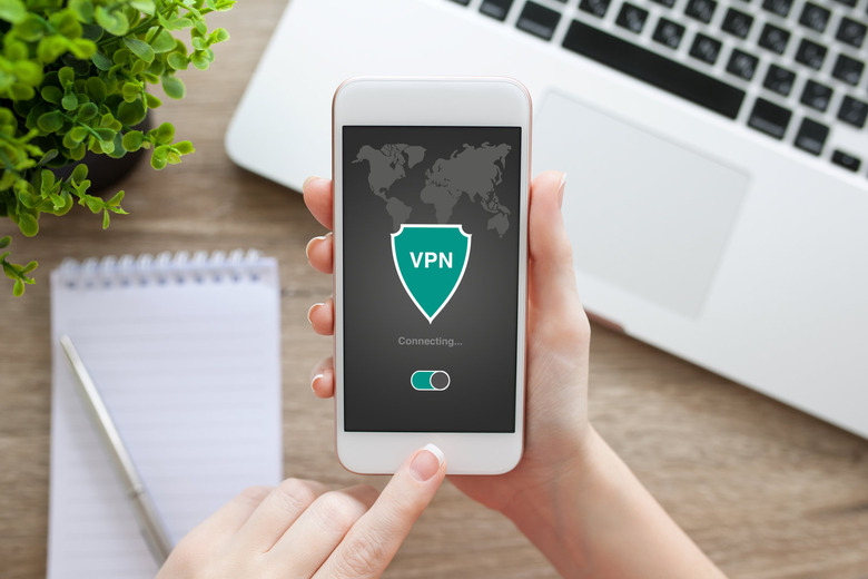 woman holding phone with app vpn creation Internet protocols for protection private network