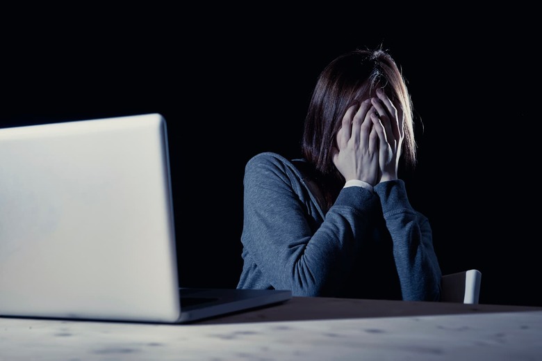 teenager girl suffering internet cyber bullying scared and depressed cyberbullying