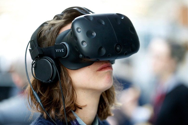 PARIS, FRANCE - FEBRUARY 08: An visitor wears a Vive virtual reality (VR) headset, manufactured by HTC Corp during the 'Virtuality Paris 2018' show on February 08, 2018 in Paris, France. The second edition of Virtuality Paris, the virtual reality fair, will be held in Paris from 08 to 10 February 2018 (Photo by Chesnot/Getty Images)