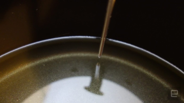 Temperature probe stopping just short of the oil in a pot