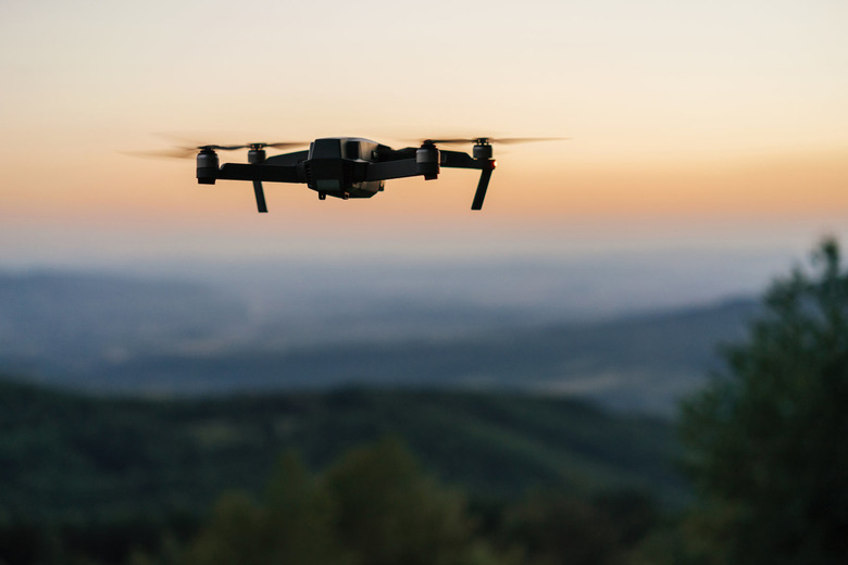Flying drone at dusk