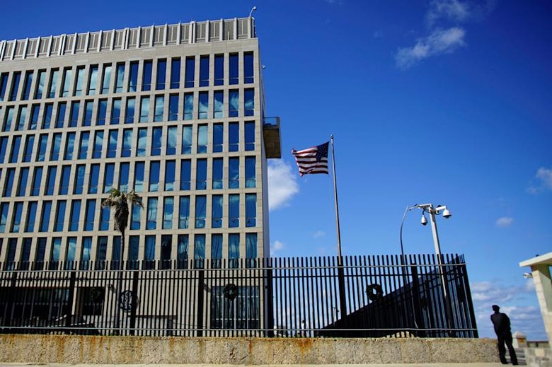 A security guard stands outside the U.S. Embassy in Havana, Cuba, December 12, 2017. REUTERS/Alexandre Meneghini