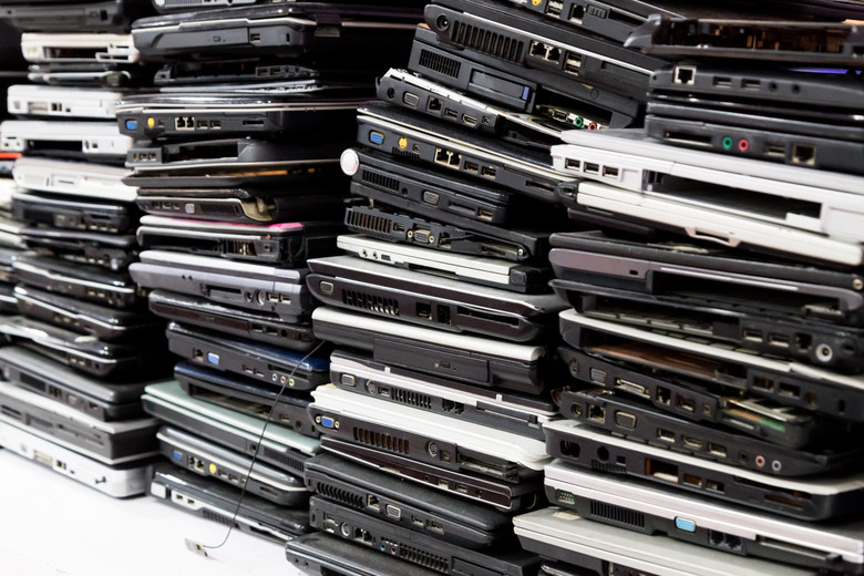 Stack of old, broken and obsolete laptop computer for repair and recycle