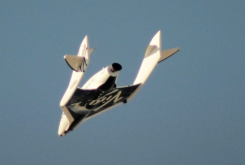 Virgin Galactic's SpaceShipTwo flies over the Mojave Desert in California April 29, 2013 shortly before successfully completing a test flight that broke the sound barrier. Virgin Galactic has been granted an operating license to fly its passenger rocketship with the world's first paying space tourists aboard once final safety tests are completed, the Federal Aviation Administration said August 1, 2016. REUTERS/Gene Blevins/File Photo