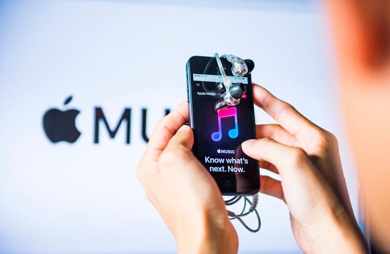 HONG KONG, HONG KONG - OCTOBER 11: A man holds an Apple iPhone5S as he uses Apple Music app on October 11, 2017 in Hong Kong, Hong Kong. (Photo by studioEAST/Getty Images)