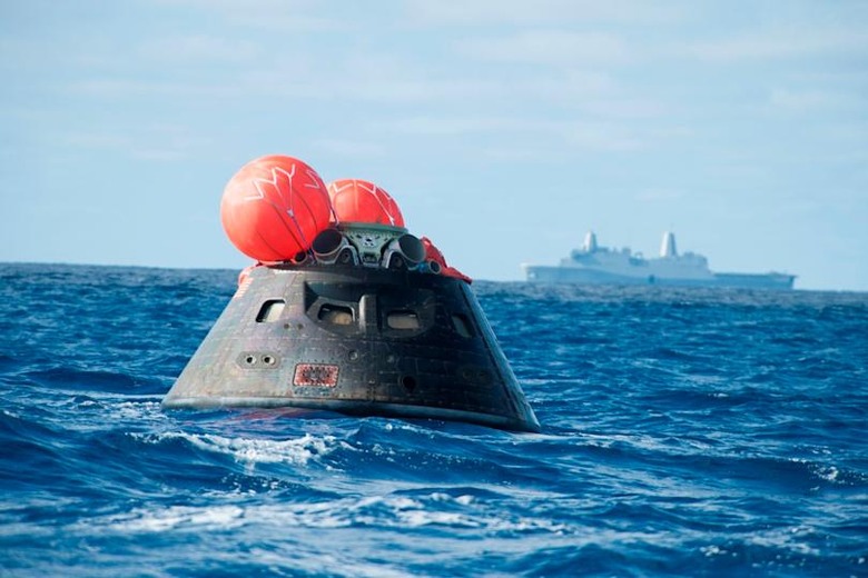 NASA's Orion spacecraft awaits the U.S. Navy's USS Anchorage for a ride home. Orion launched into space on a two-orbit, 4.5-hour test flight at 7:05 am EST on Dec. 5, and safely splashed down in the Pacific Ocean, where a combined team from NASA, the Navy and Orion prime contractor Lockheed Martin retrieved it for return to shore on board the Anchorage. It is expected to be off loaded at Naval Base San Diego on Monday. (Photo by VCG Wilson/Corbis via Getty Images)