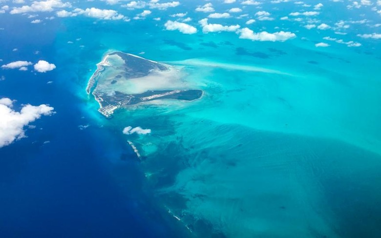 Shades of turquoise waters surround sandbanks off Eleuthera in the Bahamas as seen from a plane 25 June 2018. (Photo by Daniel SLIM / AFP) (Photo credit should read DANIEL SLIM/AFP/Getty Images)