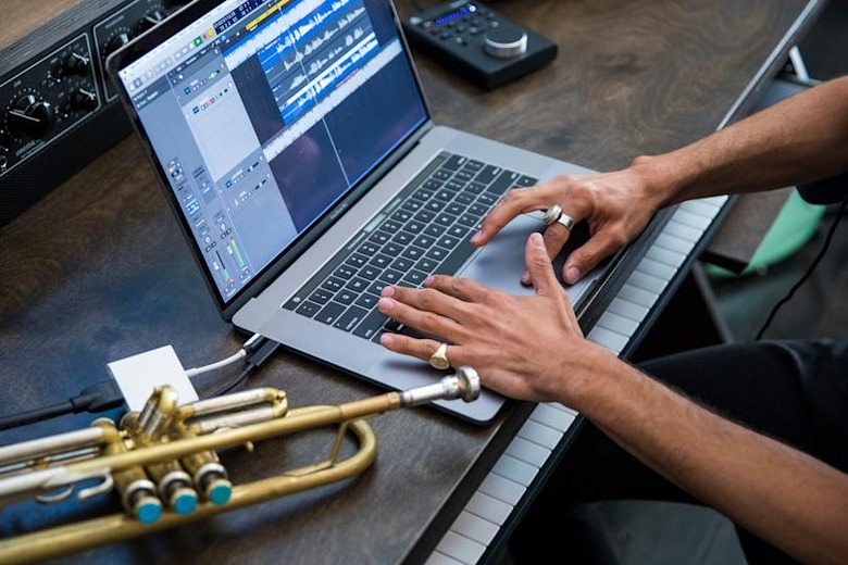 Apple holds a showcase for MacBook Pro attended by creatives, artists, developers, and scientists. 