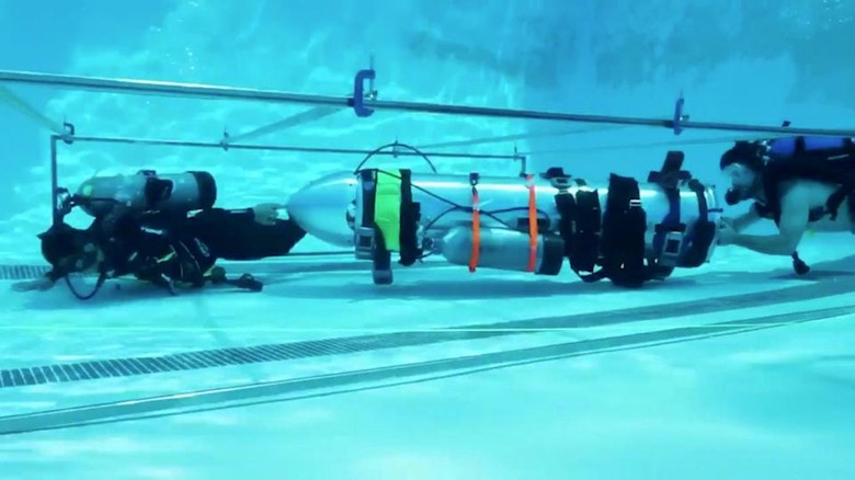A device by Elon Musk's SpaceX and The Boring Company, designed to help rescue the remaining members of a soccer team trapped in a flooded cave in Chiang Rai, Thailand, is being tested in a swimming pool in Los Angeles, California, U.S., in this still image taken from an undated video obtained from social media. MANDATORY CREDIT. Twitter @elonmusk/via REUTERS THIS IMAGE HAS BEEN SUPPLIED BY A THIRD PARTY. NO RESALES. NO ARCHIVES MANDATORY CREDIT. TPX IMAGES OF THE DAY