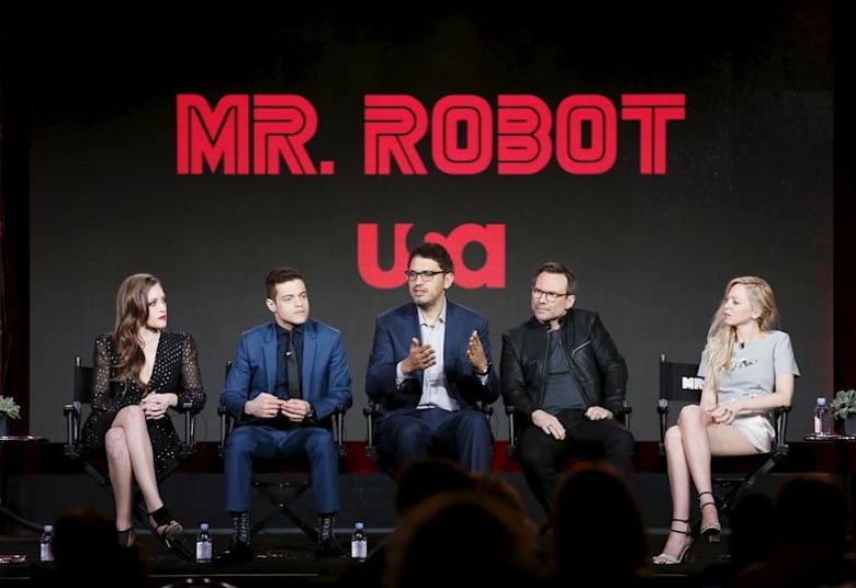 Creator and executive producer Sam Esmail (C) speaks on stage with cast members Carly Chaikin, Rami Malek, Christian Slater and Portia Doubleday (L-R) during a panel for the USA Network series 