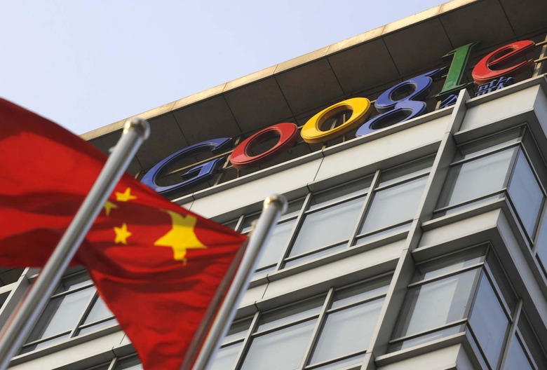 A Chinese flag flies over the company lo