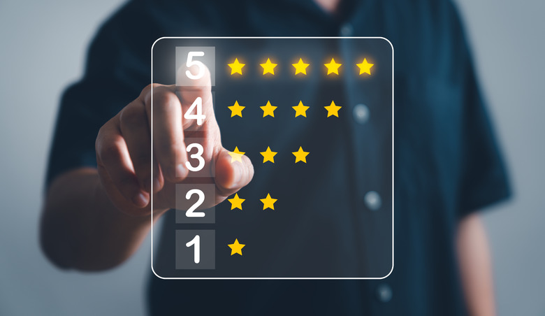 Customer service and Satisfaction concept ,Business people are touching the virtual screen on five star to give satisfaction in service. rating very impressed