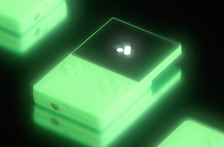 A glowing handheld console against a black backdrop.