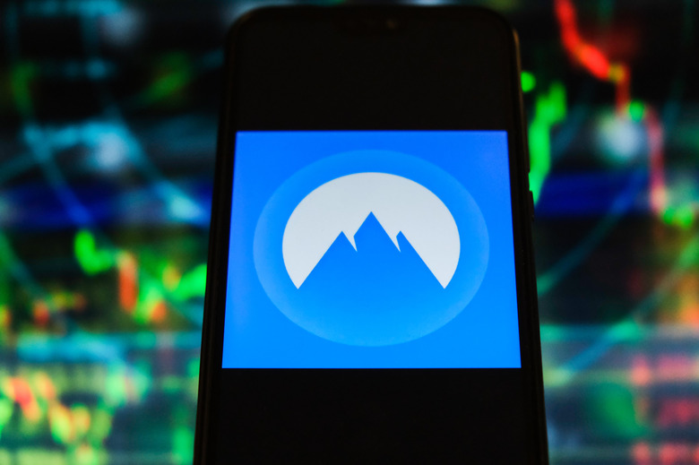 POLAND - 2020/12/02: In this photo illustration a Nord VPN logo is displayed on a smartphone with stock market graphics on the background. (Photo Illustration by Omar Marques/SOPA Images/LightRocket via Getty Images)