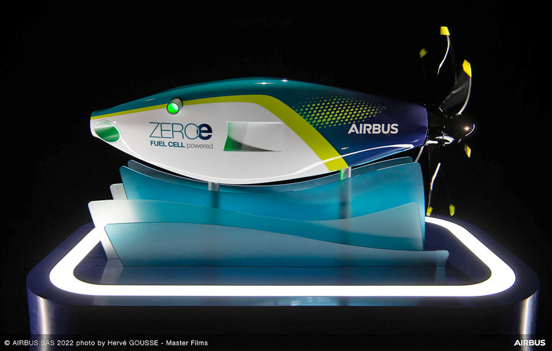 A side view of the streamlined Airbus hydrogen fuel-cell engine on a space-age aero-looking pedastal.