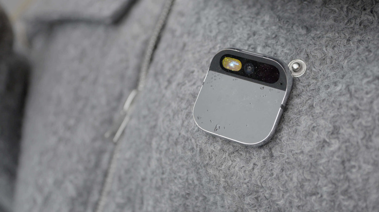 The Humane AI Pin on a wool top.