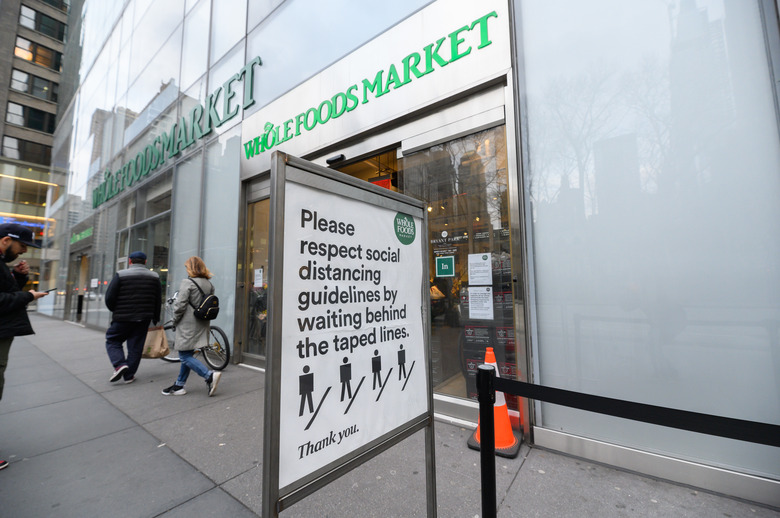 NEW YORK, NY - MARCH 31: A view outside Whole Foods Market during the Coronavirus pandemic on March 31, 2020 in New York City. President Trump has extended the social distancing guidelines to April 30. (Photo by Noam Galai/Getty Images)