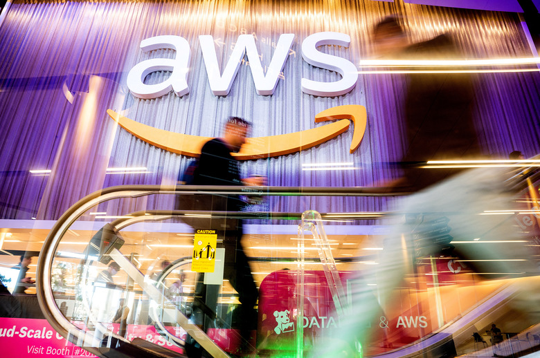 Attendees walk through AWS re:Invent 2022, a conference hosted by Amazon Web Services (AWS), in Las Vegas, Nevada, U.S., November 30, 2022. Noah Berger/AWS/Handout via REUTERS THIS IMAGE HAS BEEN SUPPLIED BY A THIRD PARTY. MANDATORY CREDIT