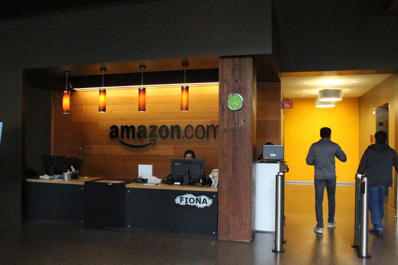 Nikol Szymul staffs a reception desk at Amazon offices discretely tucked into a building called Fiona in downtown Seattle, Washington on May 11, 2017. 
Online retail powerhouse Amazon is constructing an eye-catching Spheres office building to feature waterfalls, tropical gardens and other links to nature as part of its urban campus in Seattle, Washington.  / AFP PHOTO / Glenn CHAPMAN        (Photo credit should read GLENN CHAPMAN/AFP via Getty Images)