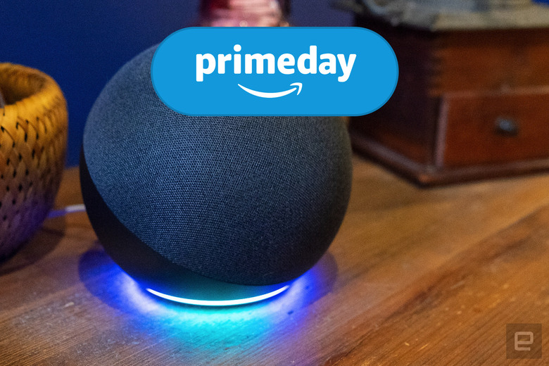 The Echo speaker sits on a wooden table with the blue ring illuminated at the bottom. Engadget's Prime Day logo is at the top of the image.