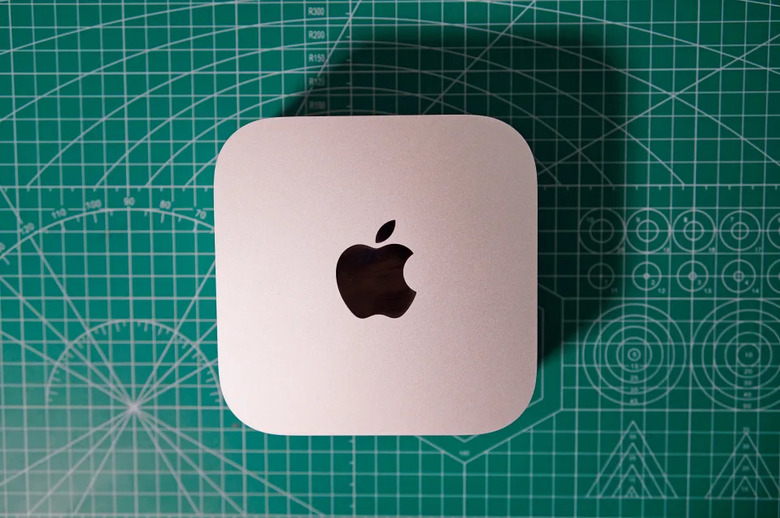 The M4 Mac Mini pictured on a green craft cutting board