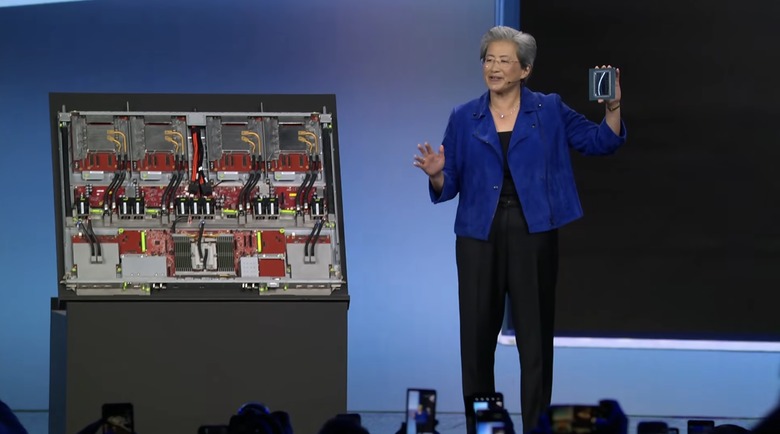 Dr. Su is showing off a compute tray from the Helios rack, which has four MI445X GPUs. (She's holding one of them up.)